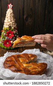 Female Hand Holding A Meat Pie
