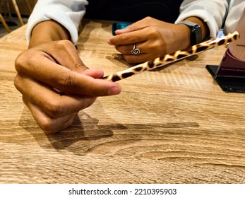 A Female Hand Holding Pencil