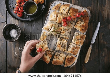 Similar – Focaccia bread with knife and olive oil