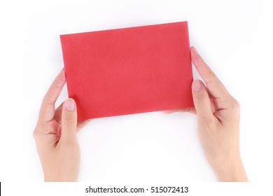 A Female Hand Holding A Red Envelope On White Background 