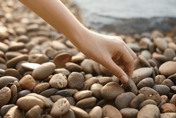 Female Hand Holding Small Pebble Stones Picking Up Pebbles, Round Shape Pebbles, Summer Vacation Souvenir,