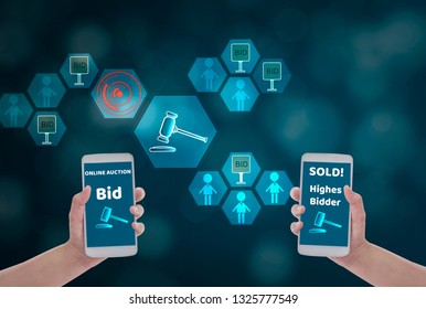 Female Hand Holding Smartphone To Enter The Price For Bid,via Wireless Network On Blue Bokeh Background With Auction Icon, Concept Online Auction Via Website ,application And Modern Technology