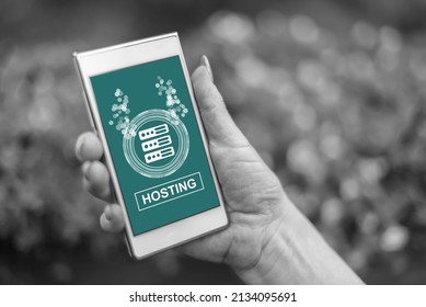 Female hand holding a smartphone with hosting concept