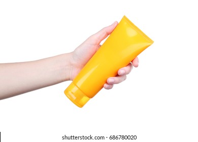 Female Hand Holding Sunscreen Cream On White Background