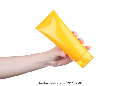 Female Hand Holding Sunscreen Cream On White Background