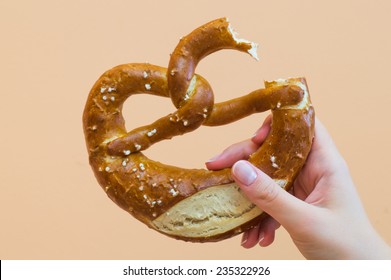 Female Hand Holding A Tasty Pretzel