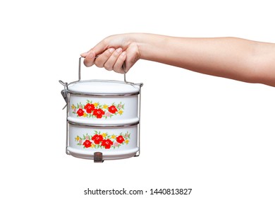 Female Hand Holding Tiffin Or Food Container On Background.