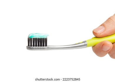 Female Hand Holding Toothbrush With Toothpaste Isolated On White Background.