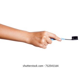 Female Hand Holding A Toothbrush With Toothpaste Isolated On White Background