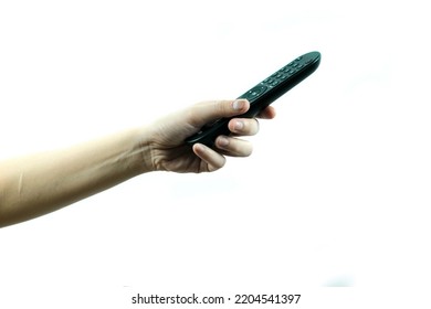 Female hand holding tv remote control on white background, technology and communication concept.