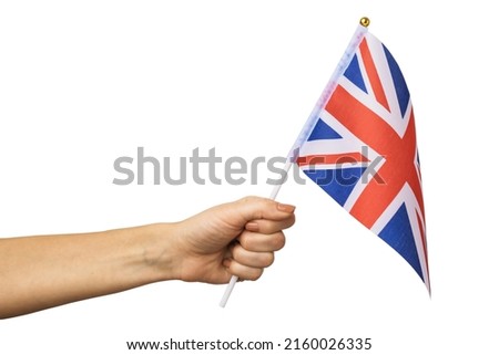 Female hand holding UK flag isolated on white background, template for designers