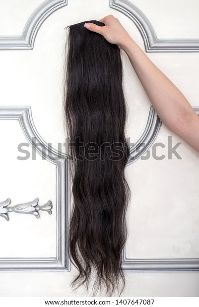 Female Hand Holding Very Long Wavy Stock Photo Edit Now 1407647087