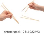 Female hand holding wooden sushi chopsticks isolated on a white background. 