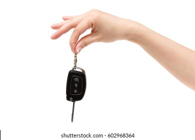 Female Hand Holds Car Keys On White Background.