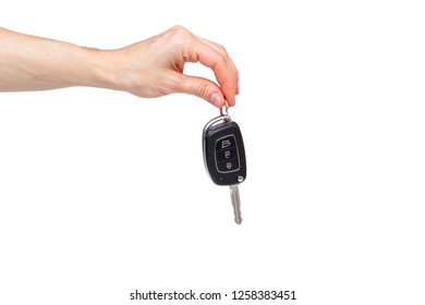 Female Hand Holds The Keys To The New Car On The White Background 