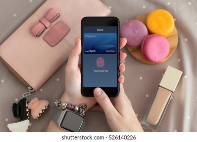 Female Hand With Jewelry Holding Phone With Online Shopping Touch And Pay