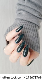 Female nails green polish