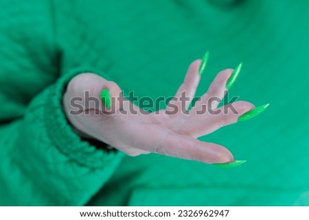 Similar – Image, Stock Photo A finger ring, spontaneously woven from blades of grass on a walk.