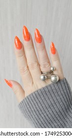 polish orange hand holds