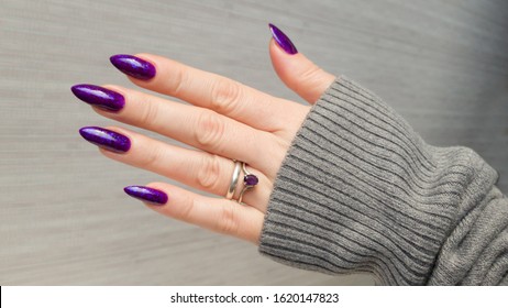 holds purple polish nails
