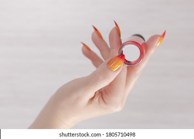 nails polish orange yellow