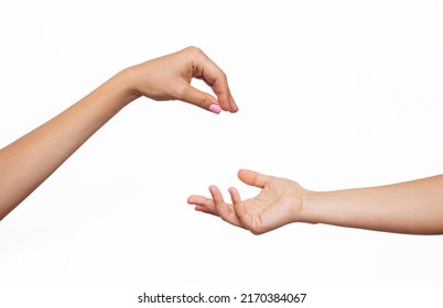 Female hand makes a gesture like handing some kind of hanging object as keys to the other outstretched hand isolated on a white background. Mockup with empty copy space for a intended object. Handover