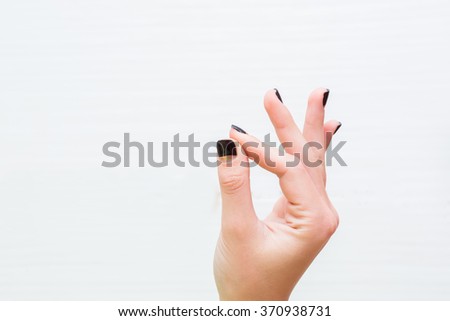 Similar – Mano negra Hand Finger