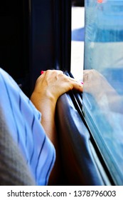 Female Hand On An Open Bus Window