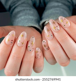 Female hand with oval-shaped nails featuring Christmas designs. Merry Christmas. New Year or Xmas party nail design. Christmas nails. Glitter nails. Holiday manicure - Powered by Shutterstock