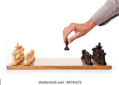 Female Hand Playing Chess. White Background.