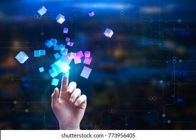 Female hand pointing at abstract glowing cubes on blurry circuit background. Innovation and creativity concept. Double exposure 