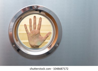 female hand in porthole