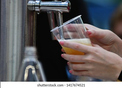 Female Hand Pouring A Beer From A Beer Tap