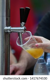 Female Hand Pouring A Beer From A Beer Tap