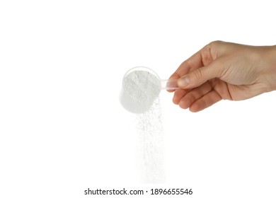 Female hand pouring washing powder, isolated on white background - Shutterstock ID 1896655546