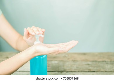 Female hand pressing bottle and pouring alcohol-based sanitize on hands. Disinfection concept. Liquid soap with pumping from bottle. 3d illustration. - Powered by Shutterstock