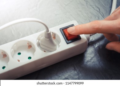 Female Hand Pressing Red Switch Of Multiple Socket Outlet, Saving Energy Concept - Shutterstock ID 1147799099