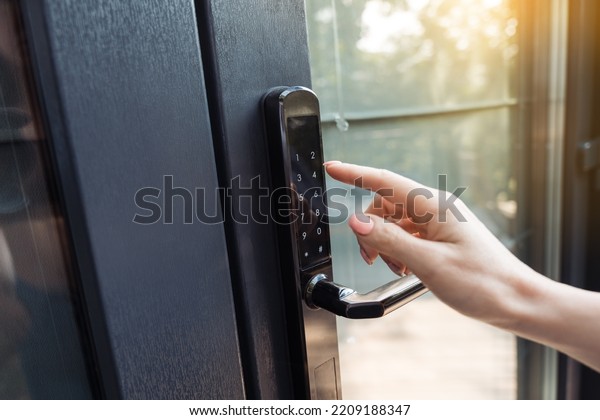 Female hand\
pushing the key of the free smart\
lock.