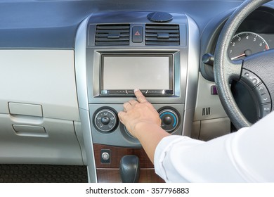 Female Hand Pushing The Power Button To Turn On The Car Radio