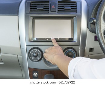 Female Hand Pushing The Power Button To Turn On The Car Radio