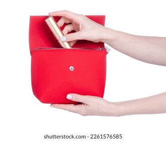 Female hand put make up brush into red bag cosmetic make up beauty on white background isolation