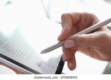 Female Hand Puts Electronic Signature In Tablet With Stylus