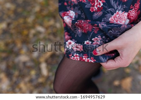 Similar – Image, Stock Photo Young woman wearing a flower shirt and using her phone