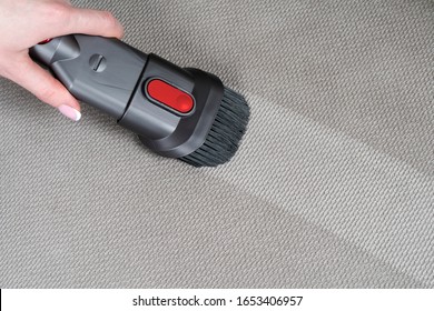 Female hand removing dirt from sofa with upholstery cleaner. Sofa chemical cleaning. Upholstered furniture cleaning. Process of deep cleaning. Dry cleaning. Before and after. Washing concept.