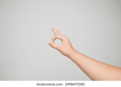 Female hand showing the ok gesture isolated on a white background. Okey hand sign

 - Powered by Shutterstock