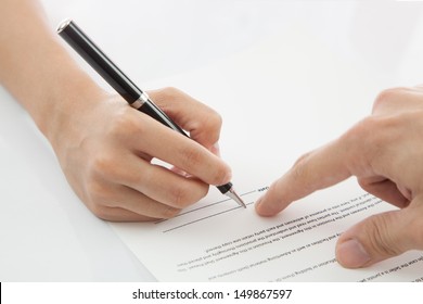 Female Hand Signing Contract.