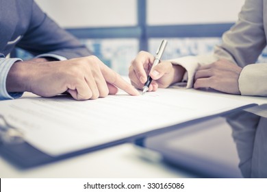 Female Hand Signing Contract.