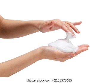 Female hand with soap bubbles on white background. Hands with white bubbles. Texture of white soap foam on female hand.