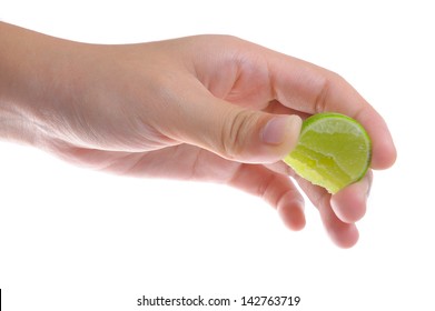 Female hand squeeze a lime.