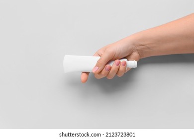 Female Hand With Tooth Paste On White Background